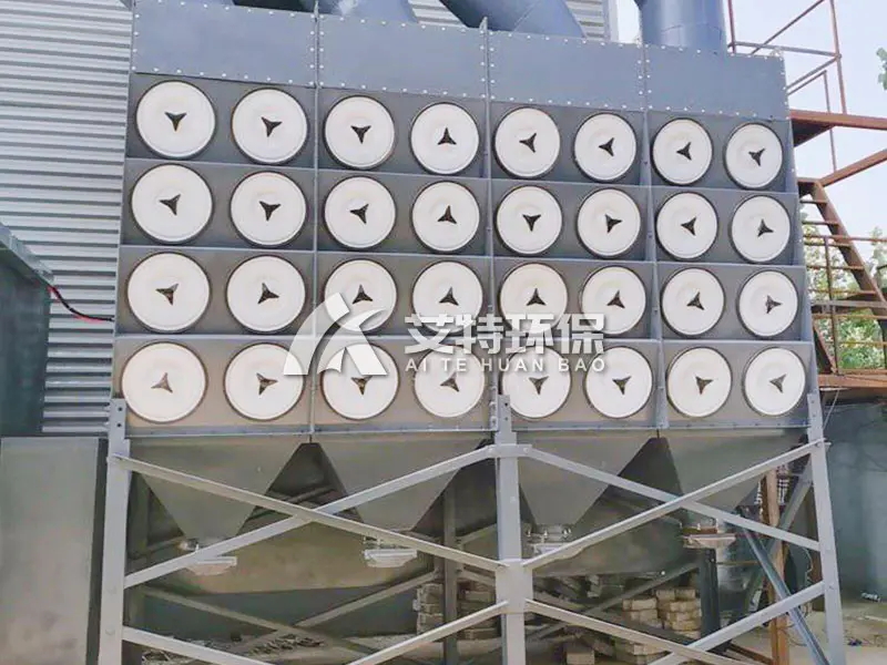 Ultra-low discharge cartridge dust collector